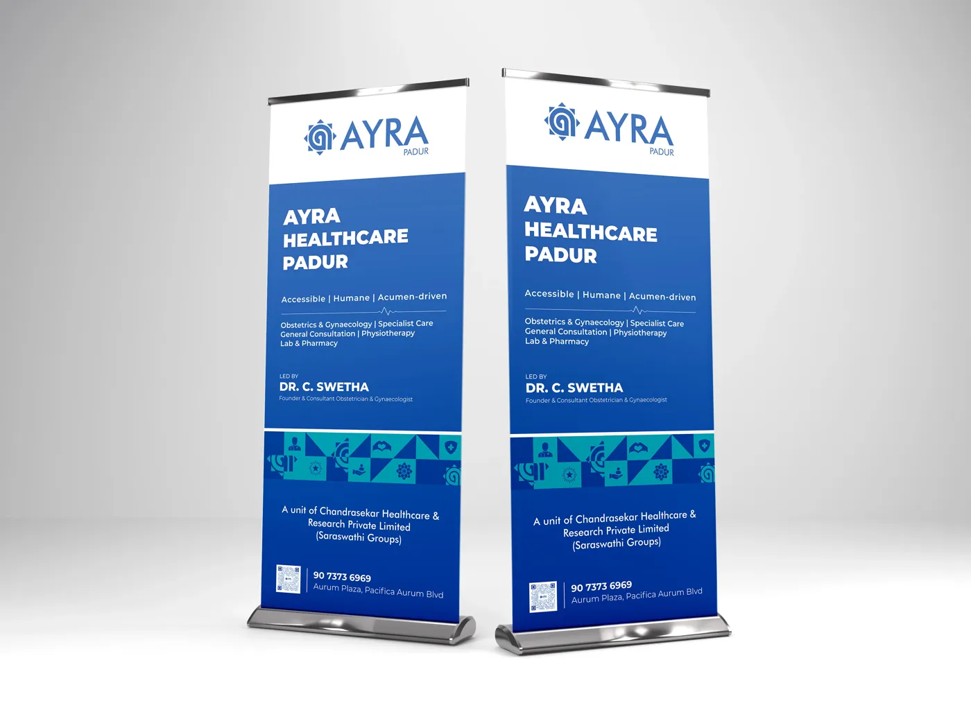 Two blue Ayra Healthcare roll-up banners with a QR code and contact number