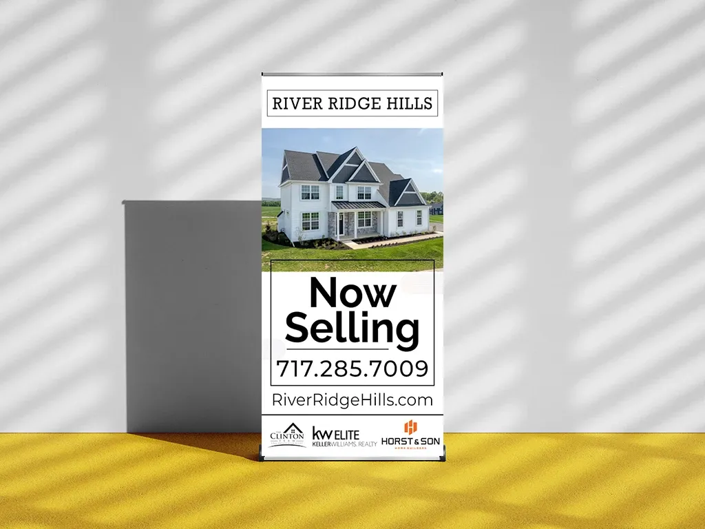 River Ridge Hills roll-up banner reading Now Selling